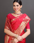 Woman wearing a red saree with gold patterns on a gray background