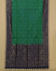 Green and black patterned fabric with a plain background