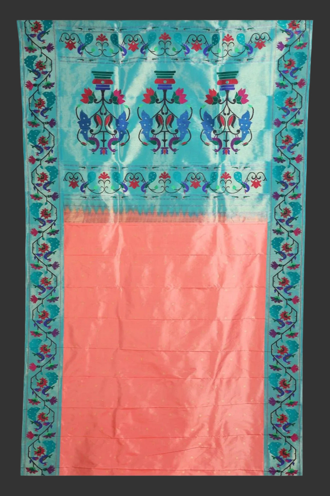 Saree with blue and pink design on a white background