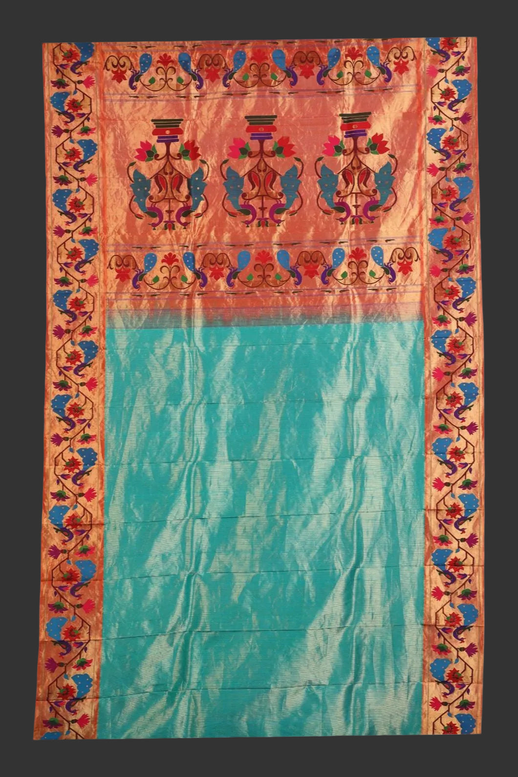 Traditional fabric with colorful border and turquoise center