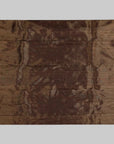 Brown fabric with colorful embroidered border on a white background