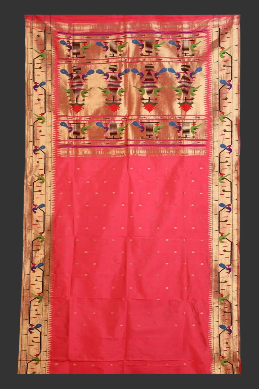 Red saree with intricate gold and multicolor patterns