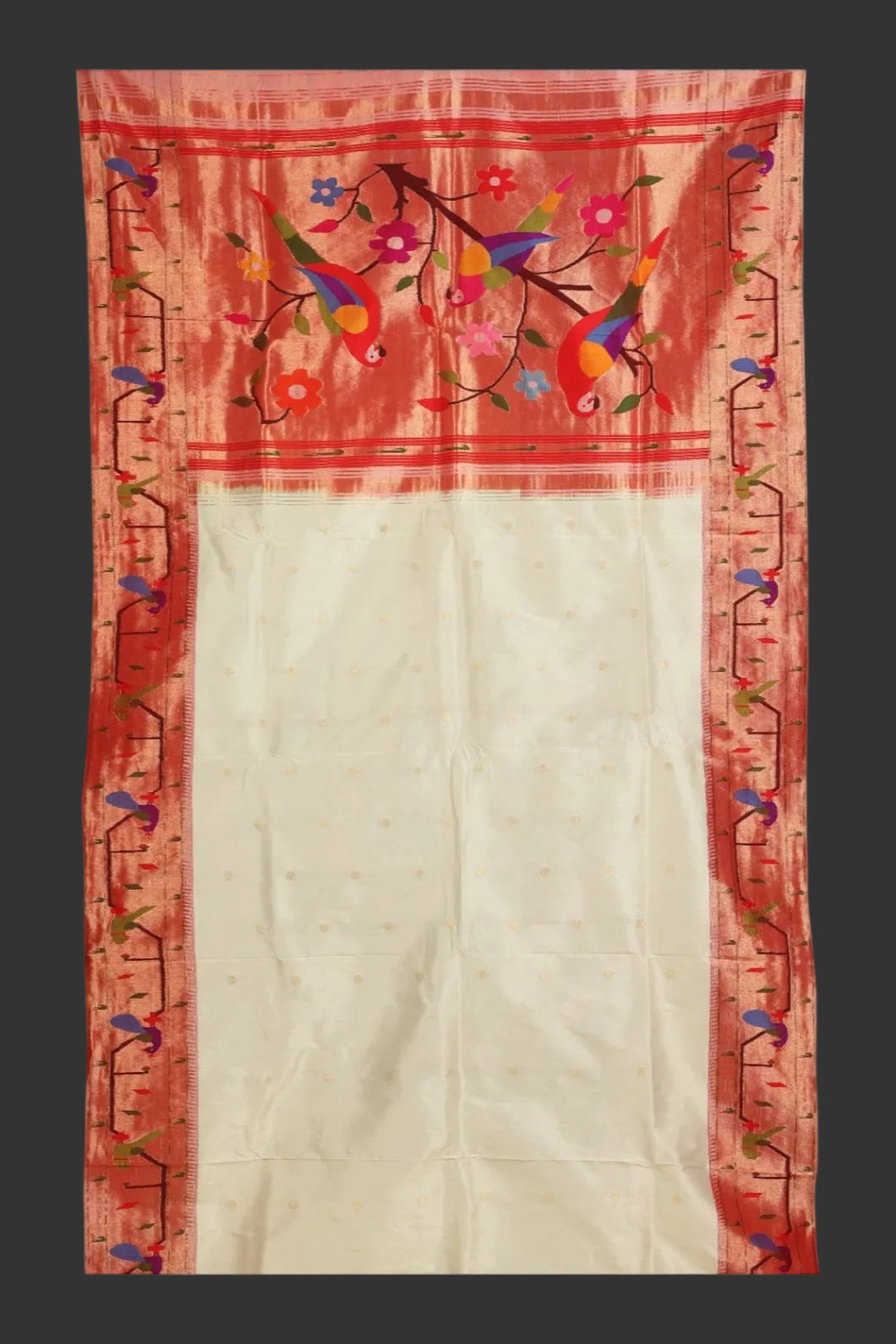 Saree with red border featuring colorful floral and bird patterns on a white background