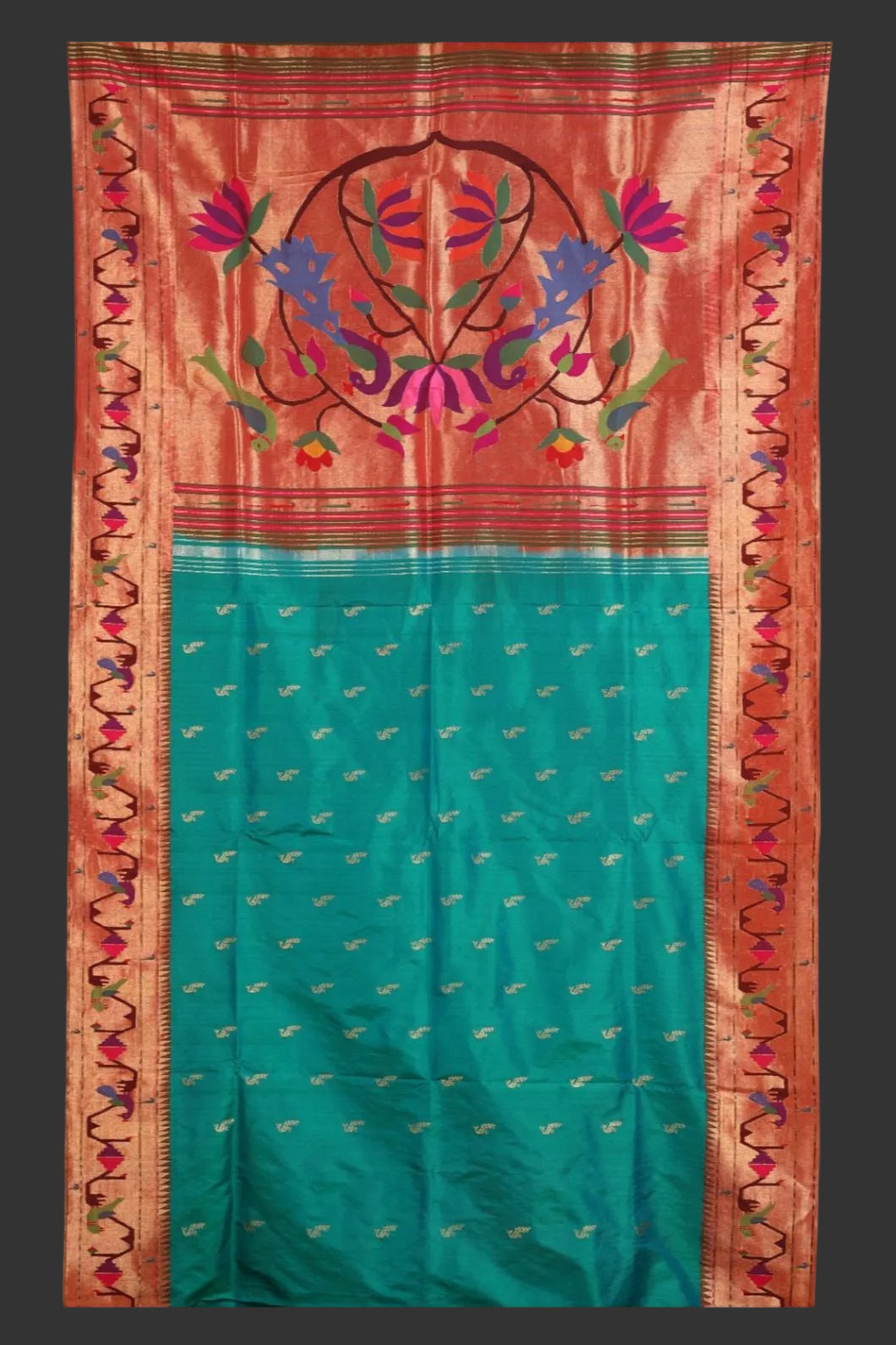 Traditional saree with floral patterns on a red and green background
