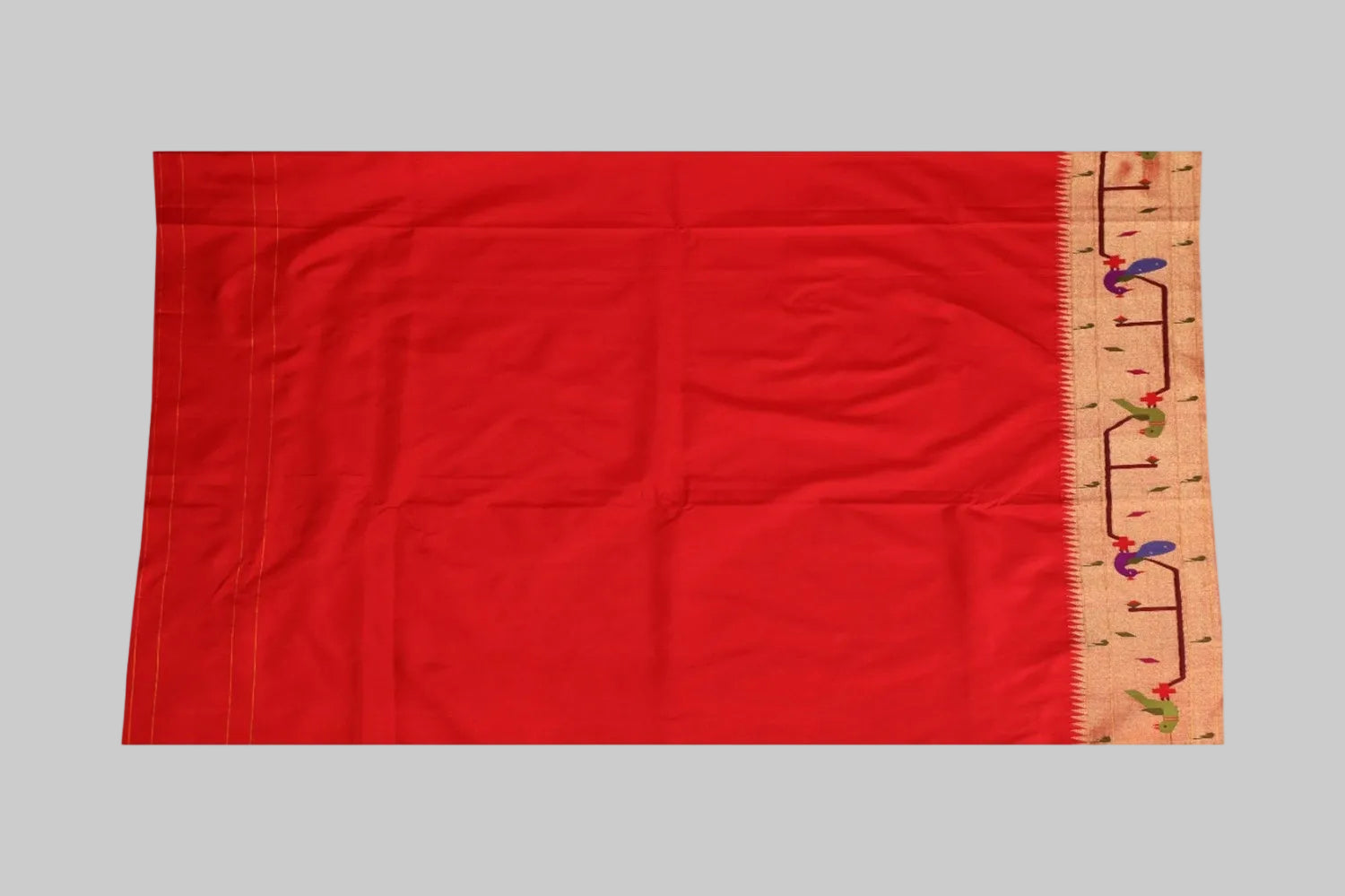 Red fabric with a ruler on the right side for scale