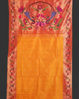 Decorative fabric with floral patterns on a red and orange background