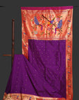 Purple saree with a colorful floral design on an orange background