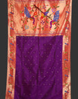Saree with floral and bird design on a pink background