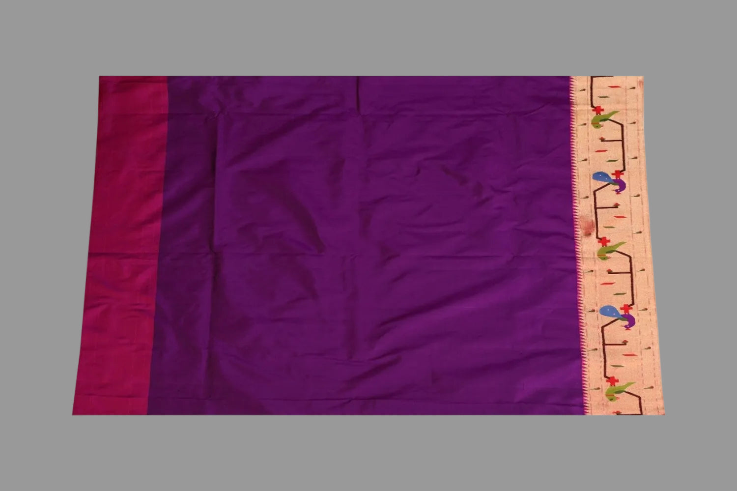 Purple fabric with a ruler on the right side for scale