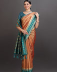 Woman wearing a traditional saree with a dark background