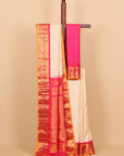 Cream by red small zari checks gadhwal saree